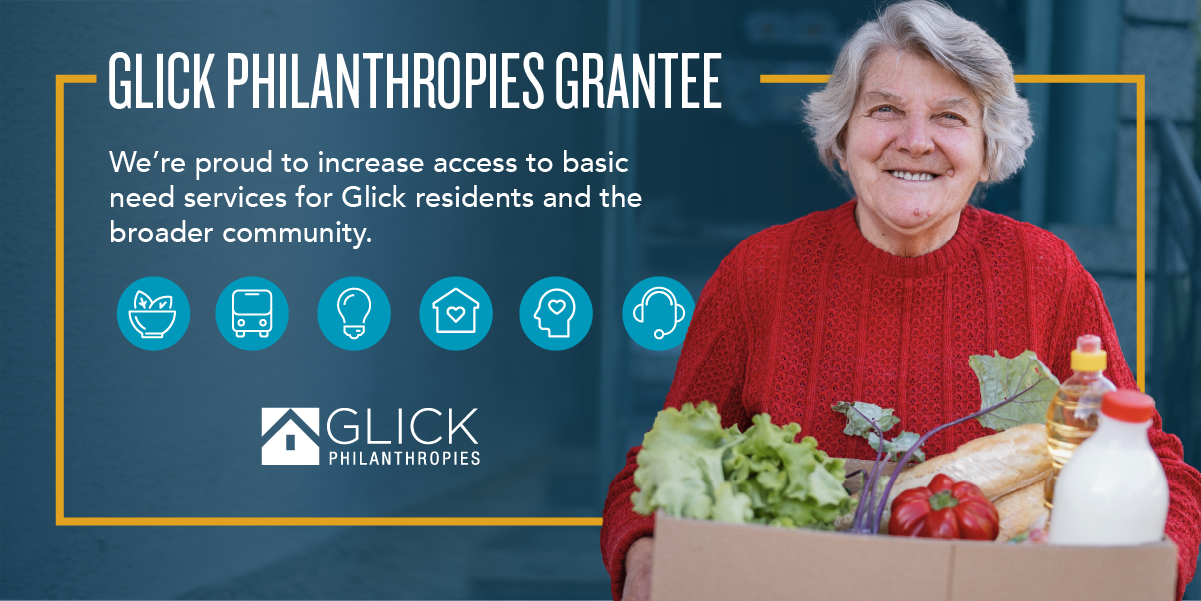 elderly woman holding box of food delivered to her door