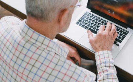 older man on laptop computer