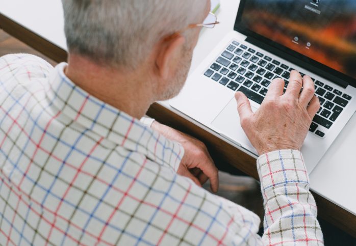 older man on laptop computer