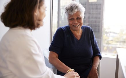 Woman talking with doctor