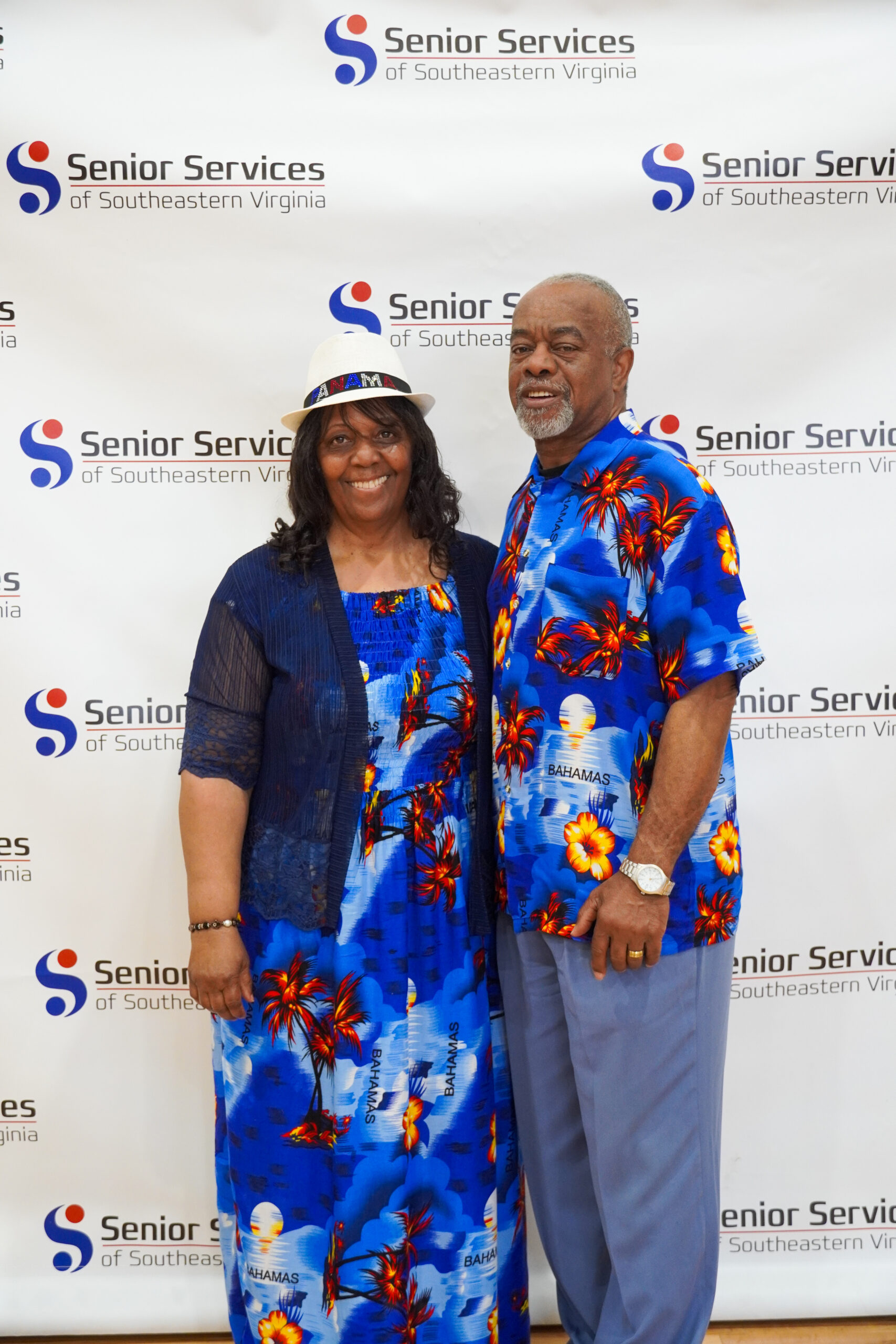 couple posing for camera with senior services background
