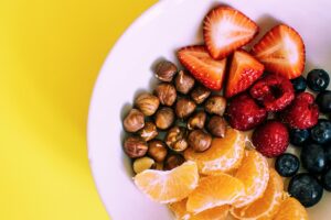 fruit and hazelnuts on a plate