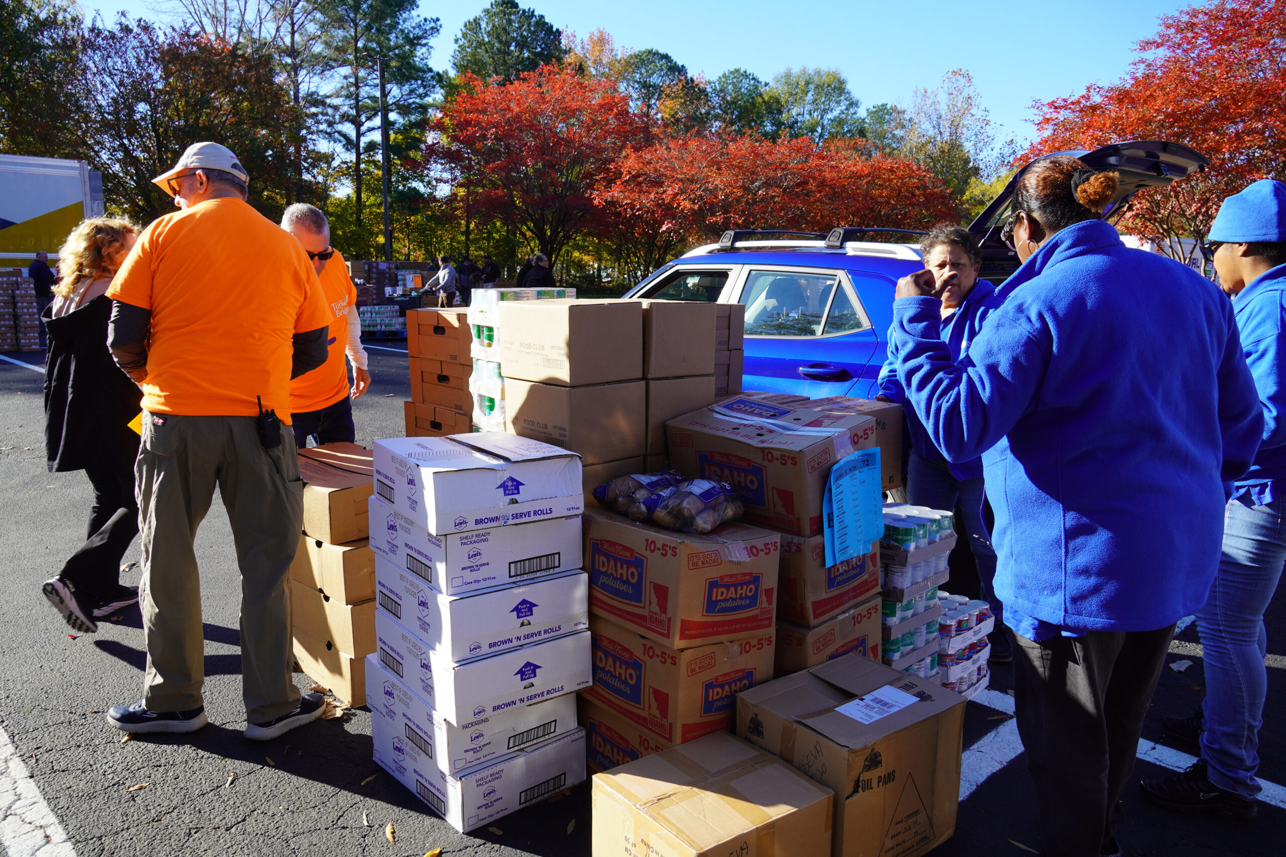 people outside around boxes of supplies