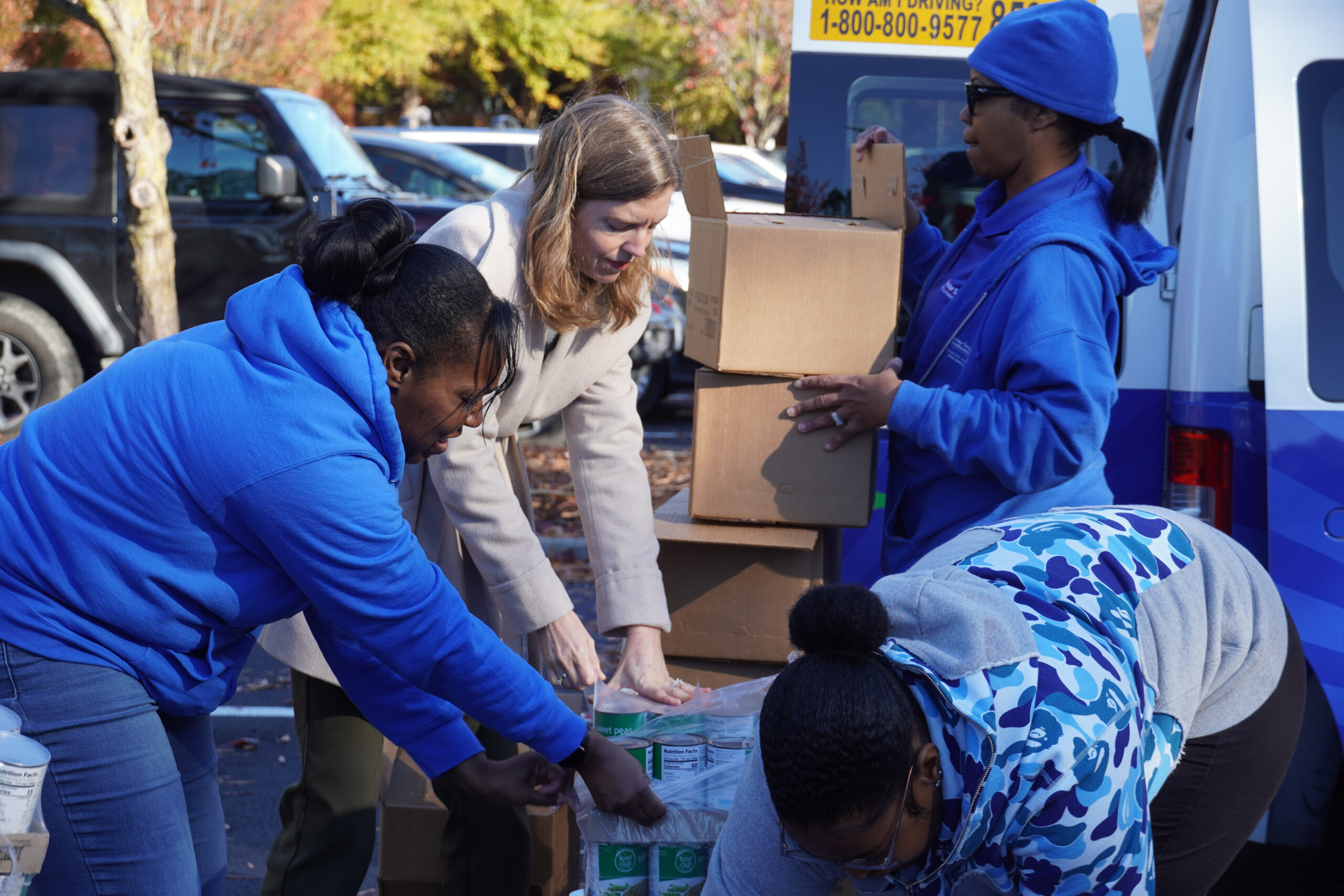 women organizing supplies utside