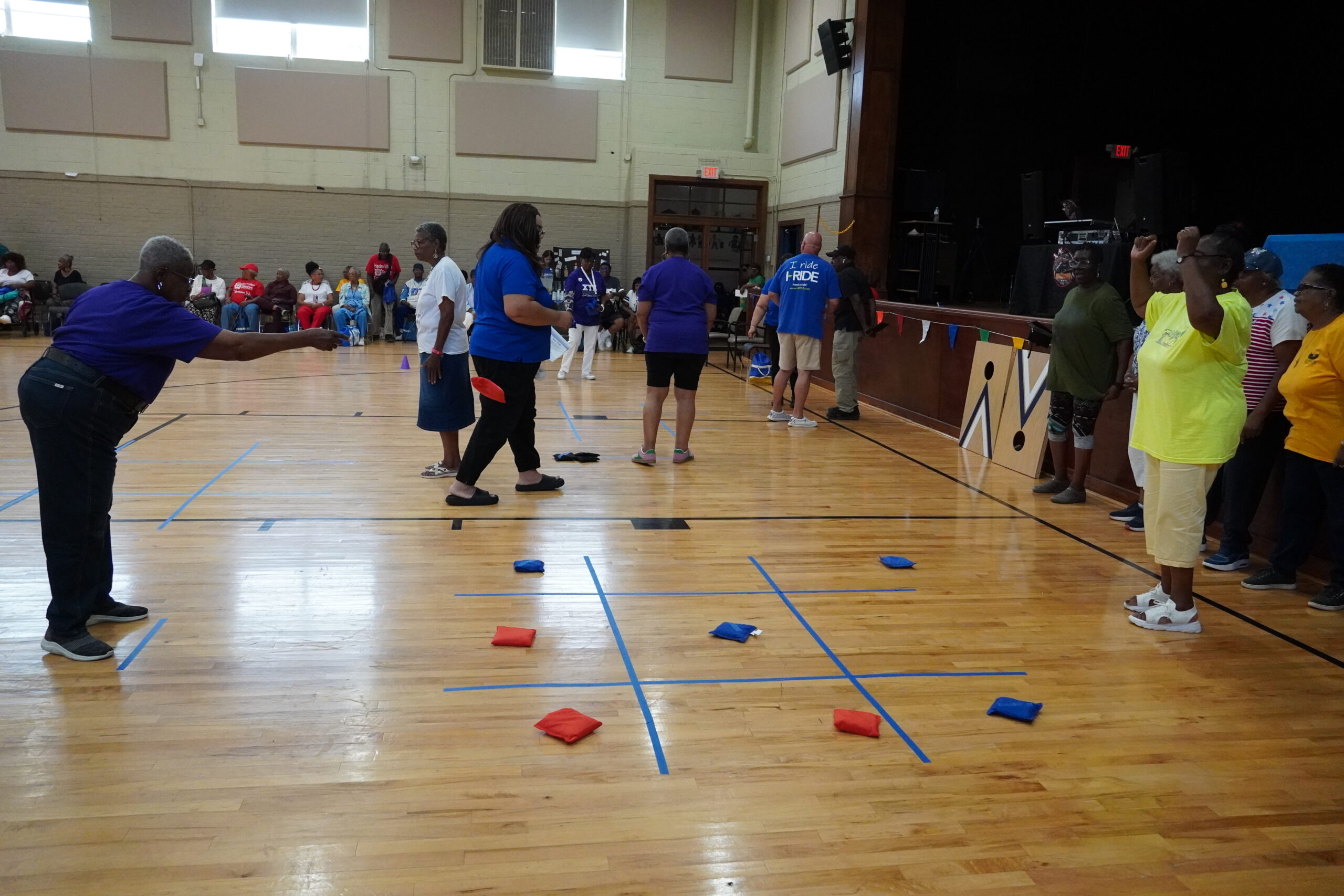 seniors playing tik-tac-toe with cornhole sacks