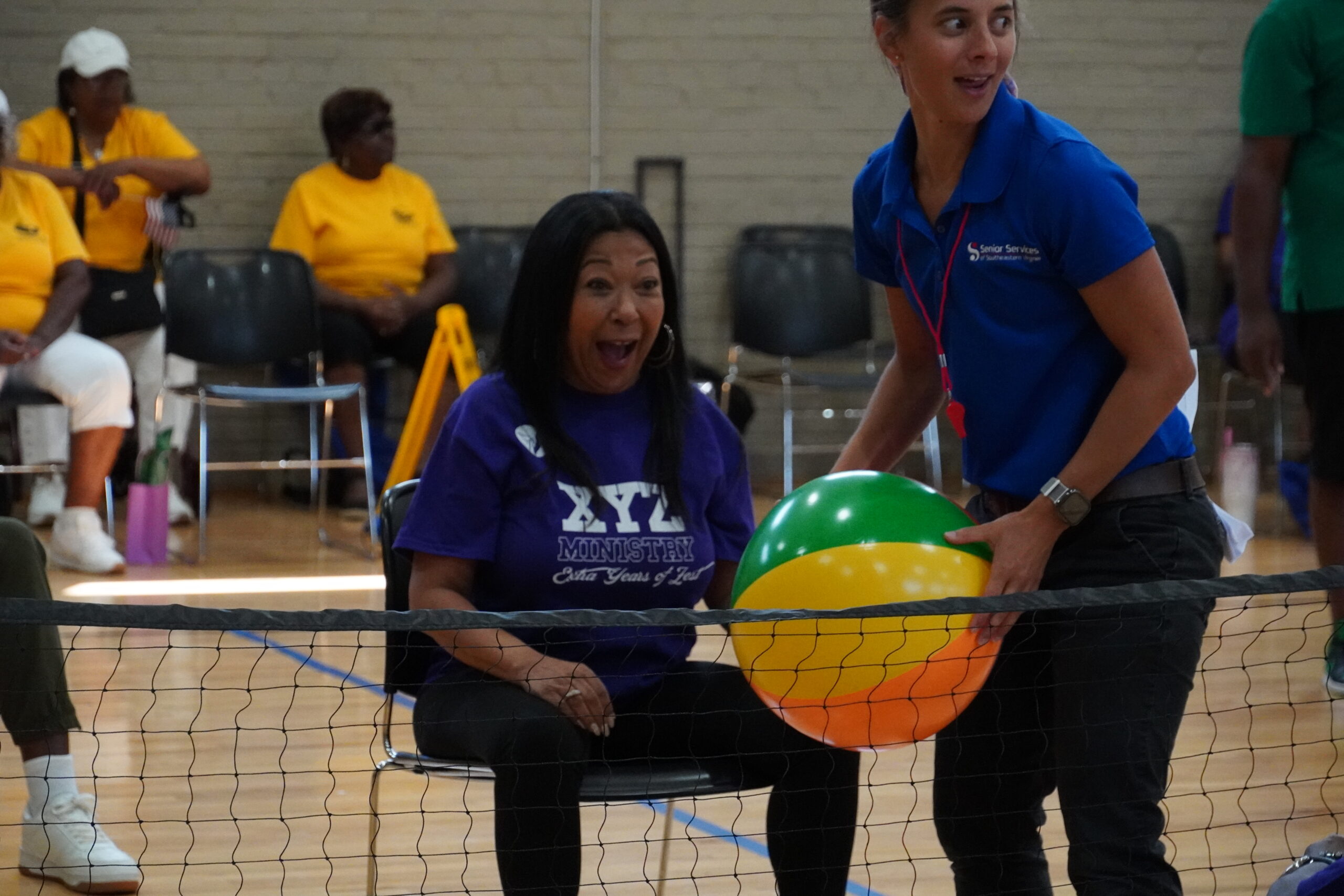 woman playing chair volleyball