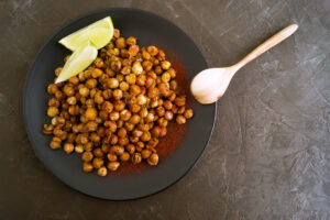 Roasted spicy chickpeas on a rustic background.